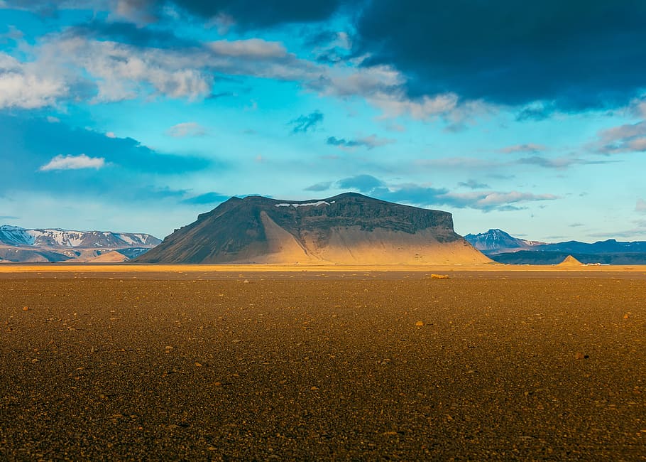 mountain under white clouds during daytime, brown mountain beside desert during daytime HD wallpaper