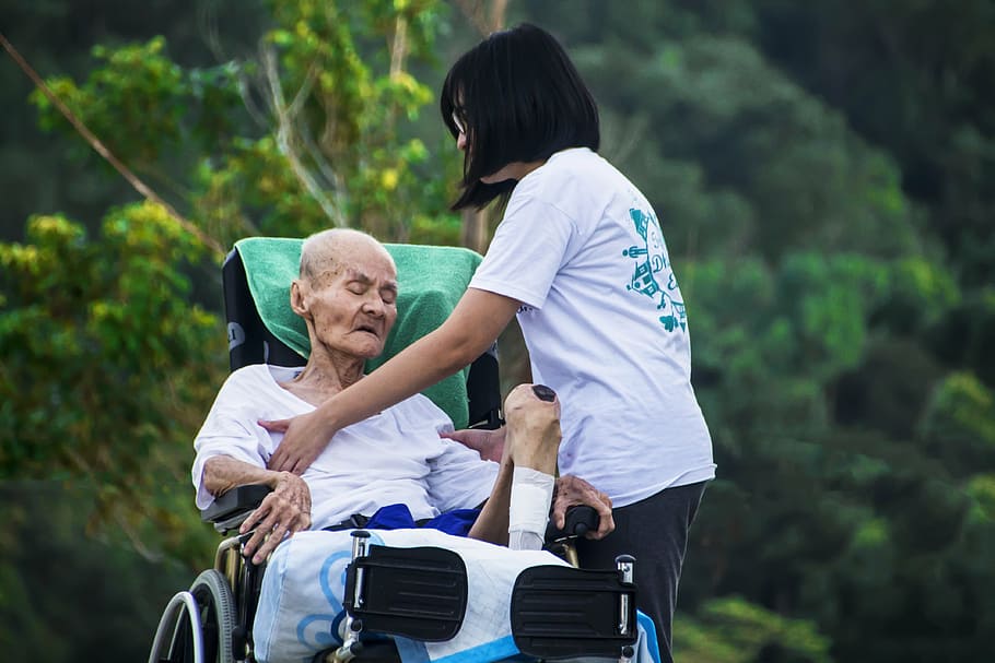 grandfather sitting on wheel chair beside girl, hospice, caring HD wallpaper