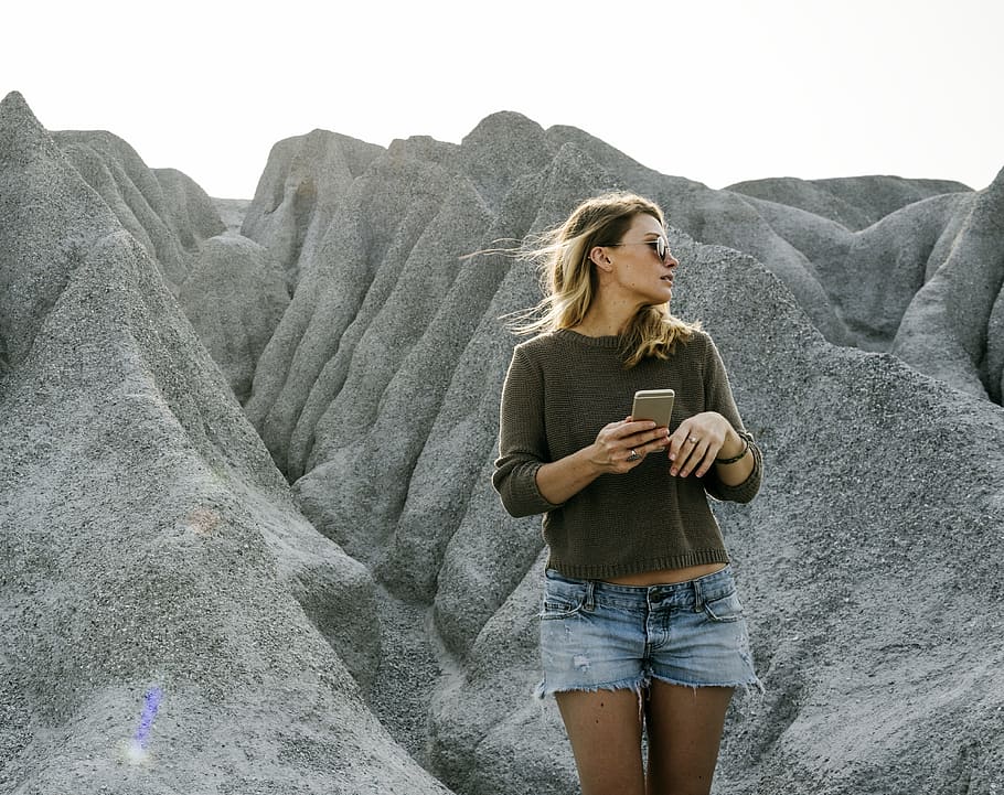 woman standing near rock formation, chill, enjoyment, dom, girl, HD wallpaper