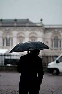 person holding black umbrella standing near white vehicle, person under the umbrella in selective color photography HD wallpaper