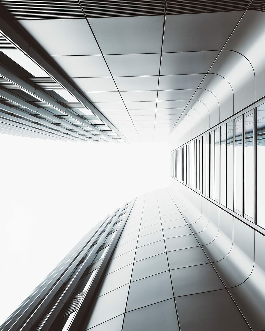 low angle photography of high-rise building, grey concrete building HD wallpaper