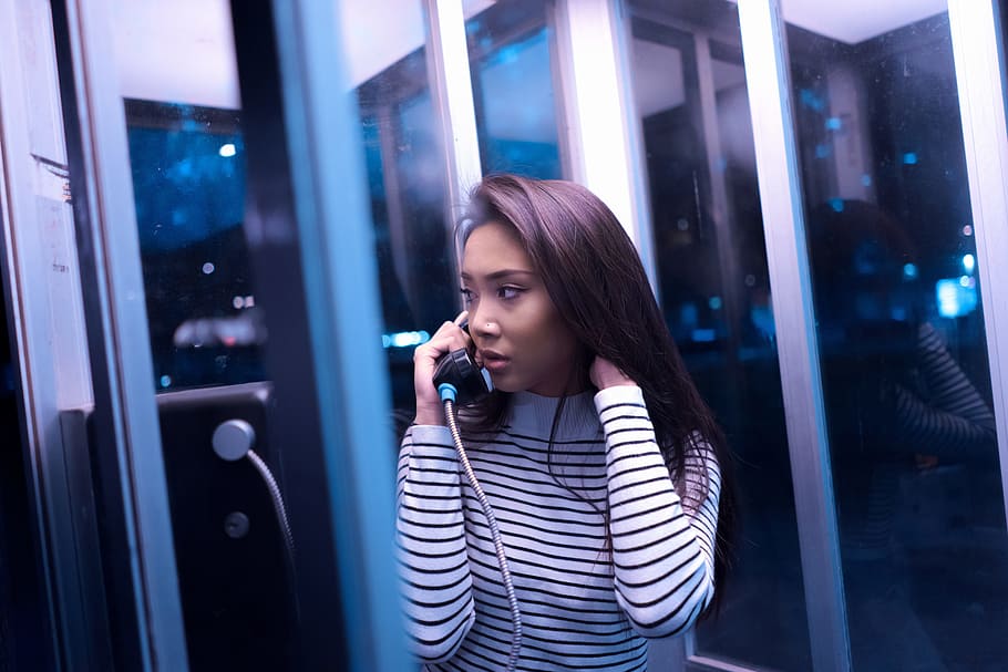 woman inside telephone booth while calling, people, girl, beauty