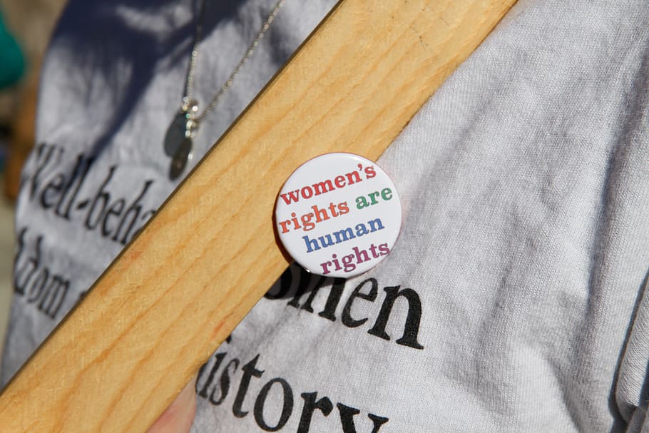 person wearing white women's rights are human rights pin-back buttons, HD wallpaper