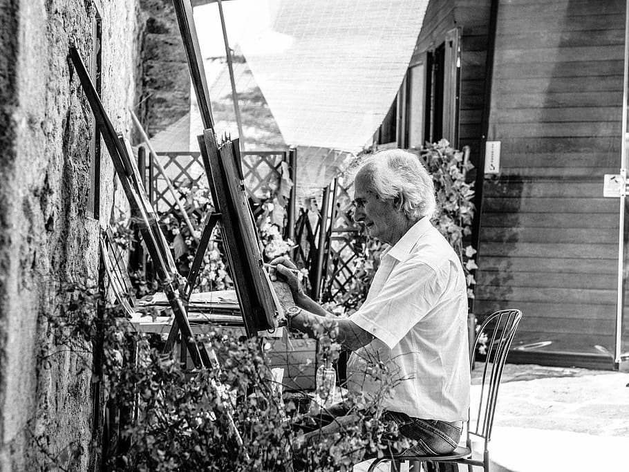 grayscale photo of man sitting while painting, grayscale photo of man sitting on chair while painting HD wallpaper