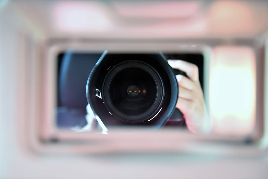 shallow focus photography of camera len, person holding camera HD wallpaper