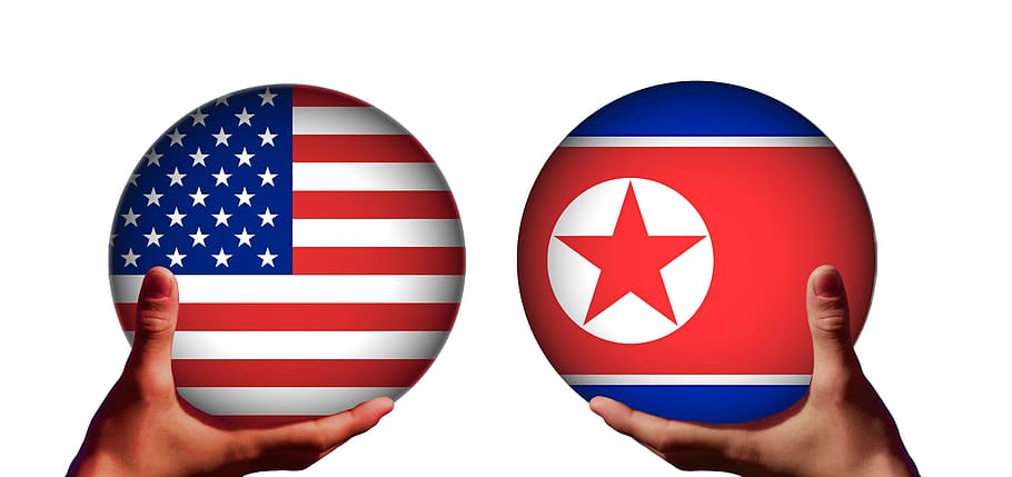 two hands holding American flag and flag wallpaper, usa, north korea