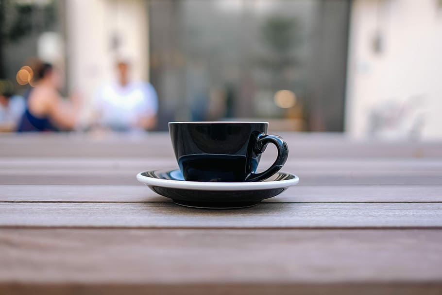 black ceramic teacup on brown surface, black cup and saucer on brown panel HD wallpaper