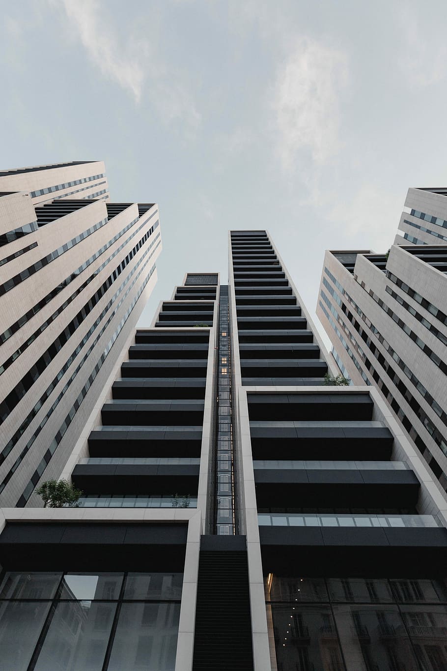 low-angle photography of black painted high-rise building, low-angle photography of building