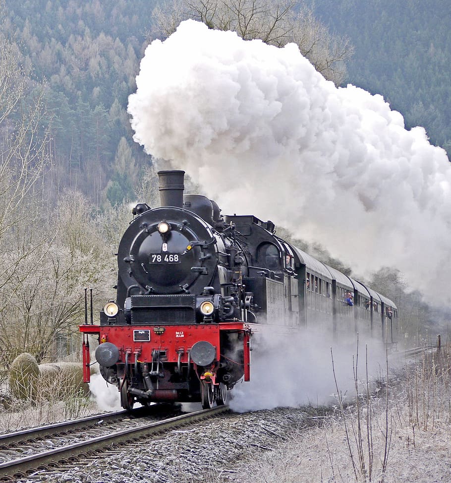 red and black train with smoke during daytim, steam locomotive