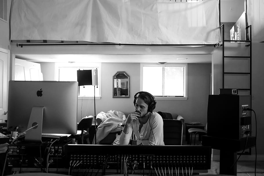 man listening music on headphones, man inside music listening to music in greyscale photo HD wallpaper