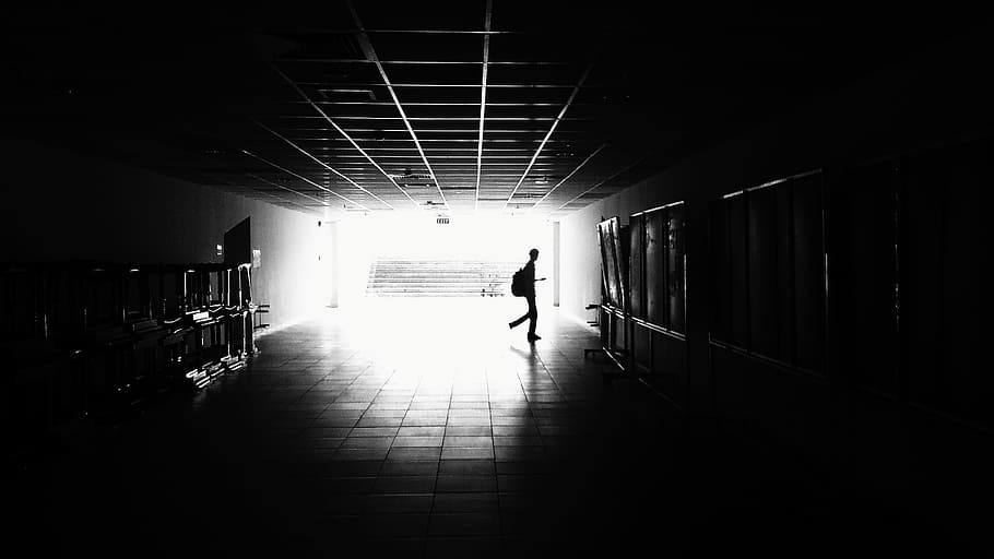 Silhouette of Man Walking on Hall, architecture, black-and-white