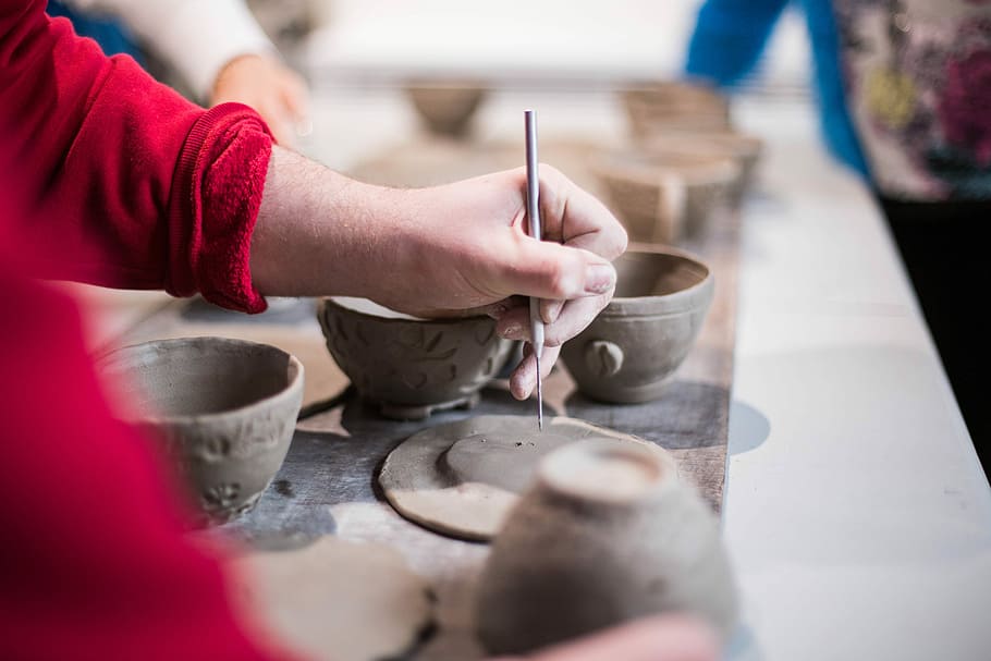 person doing clay containers, person sculpturing cup and saucer from clay HD wallpaper