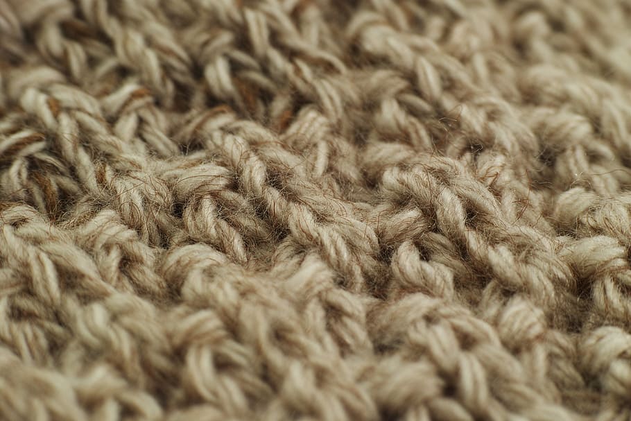 closeup photography of brown knitted mat, fabric, wool, yarn