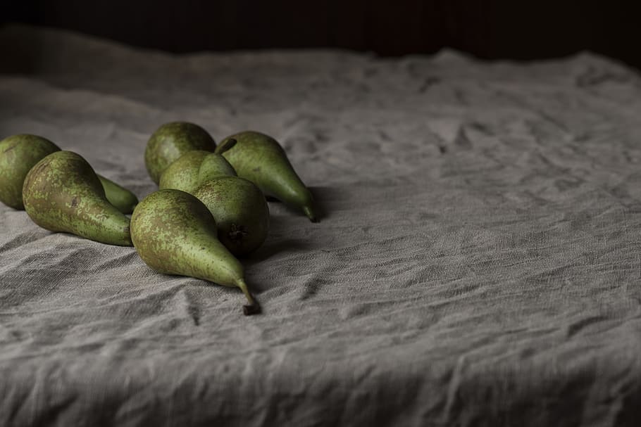 green Avocado fruits, seven green oval fruits on grey textile HD wallpaper