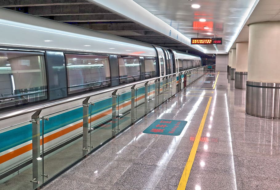 white, teal, and orange train at train station, transrapid HD wallpaper