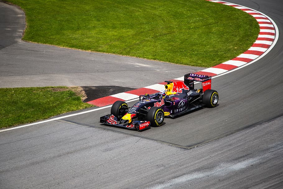 Red Bull-themed f1 race car, racing, sports, grass, field, wheels