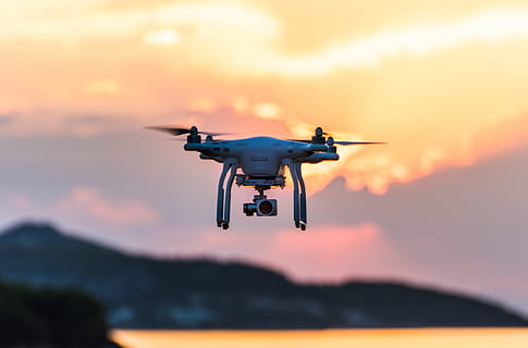 white quad-copter drone during golden hour, white drone with camera focus photography HD wallpaper