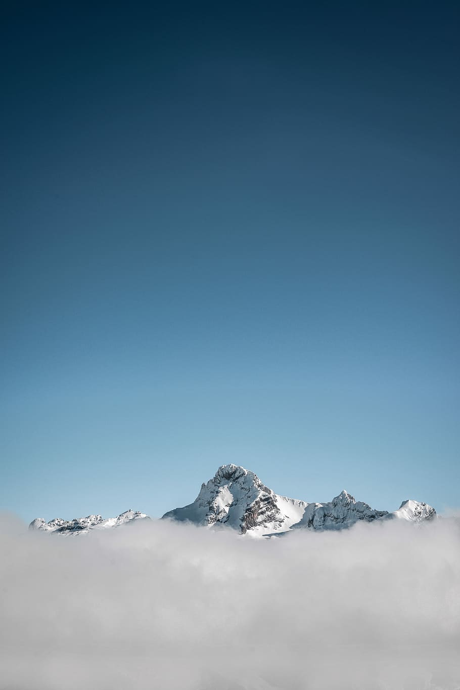 selective focus photography of white mountain under blue calm sky, snow covered mountain HD wallpaper