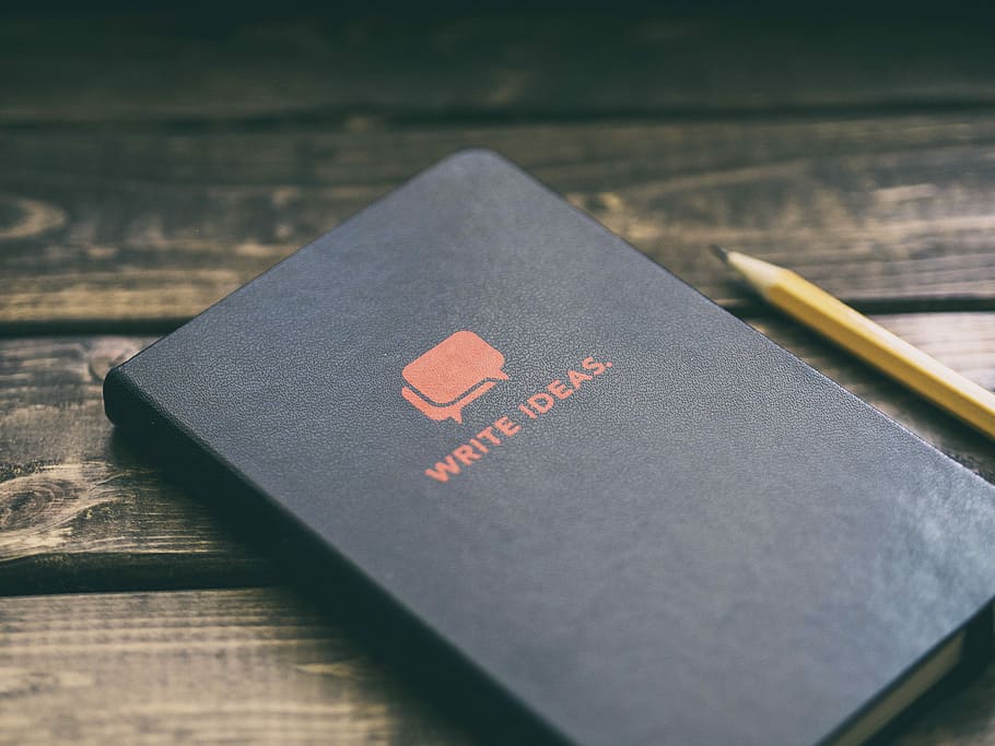Write Ideas book on brown wooden board, Write Ideas book near brown pencil HD wallpaper