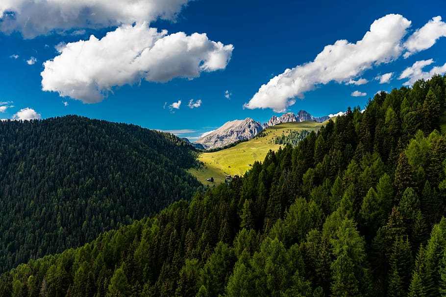 aerial shot of mountains, green leafed trees on hills under sunny cloudy sky during daytime HD wallpaper
