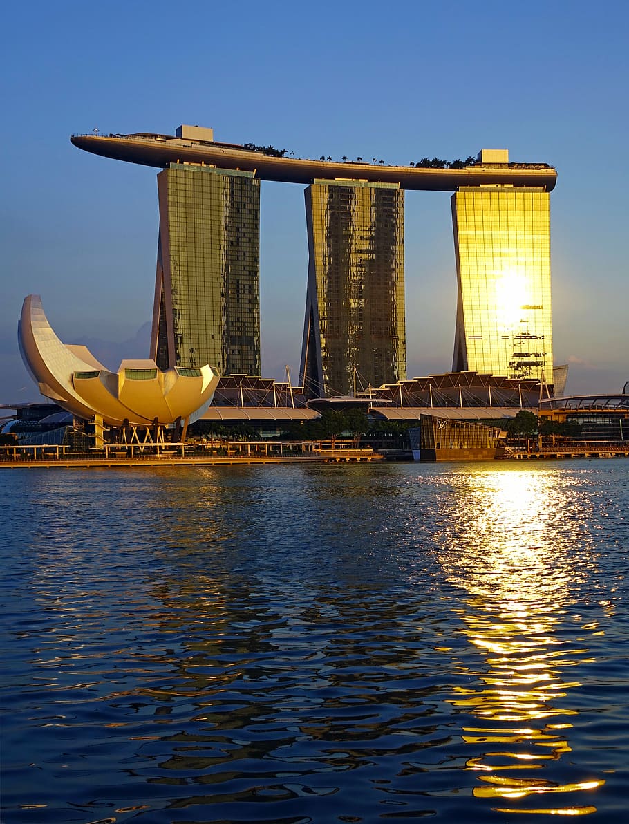white infrastructure beside body of water, singapore, marina bay sands