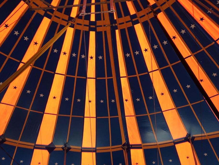 low angle photography of inside yellow and blue star print structure