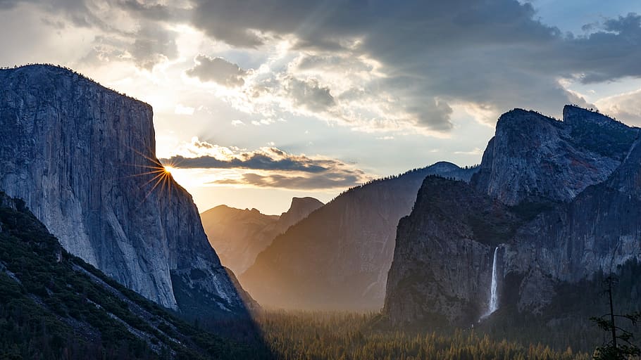landscape photography of mountain, mountain with waterfalls under cloudy sky HD wallpaper