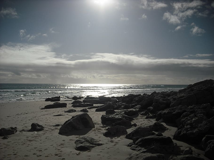 sunlight, beach, coastal, ocean, sea, water, rocks, sand, rocky HD wallpaper