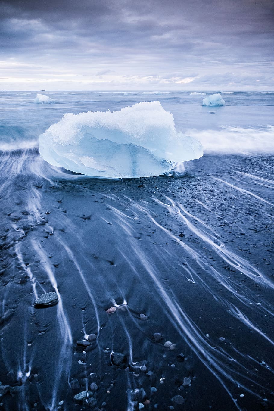 time lapse photography of ice berg, snow block on seashore under gray clouds HD wallpaper
