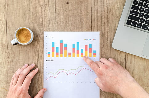 person hand's on top of white diagram, chart, graph, finance HD wallpaper