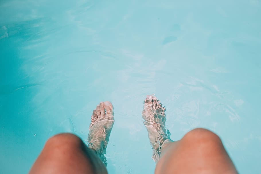 person's feet on body of water, legs, leisure, outdoors, pool