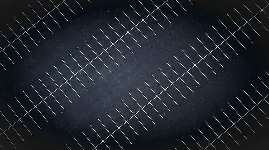 A drone view at night of parking lot lines, black road with white lines HD wallpaper