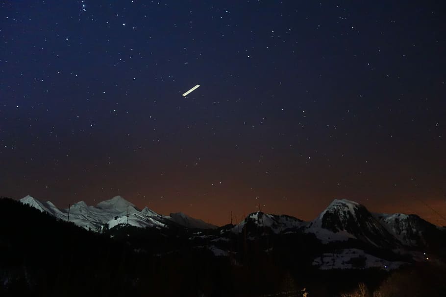 silhouette photo of mountains covered in snow at nighttime, snowy mountain HD wallpaper