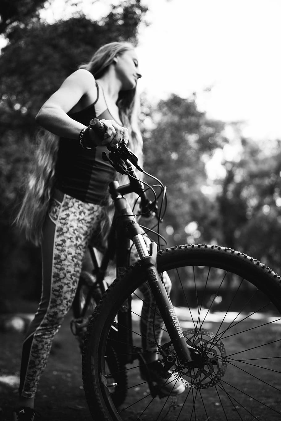 woman riding bicycle near trees, grayscale photo of woman using hardtail bicycle, HD wallpaper