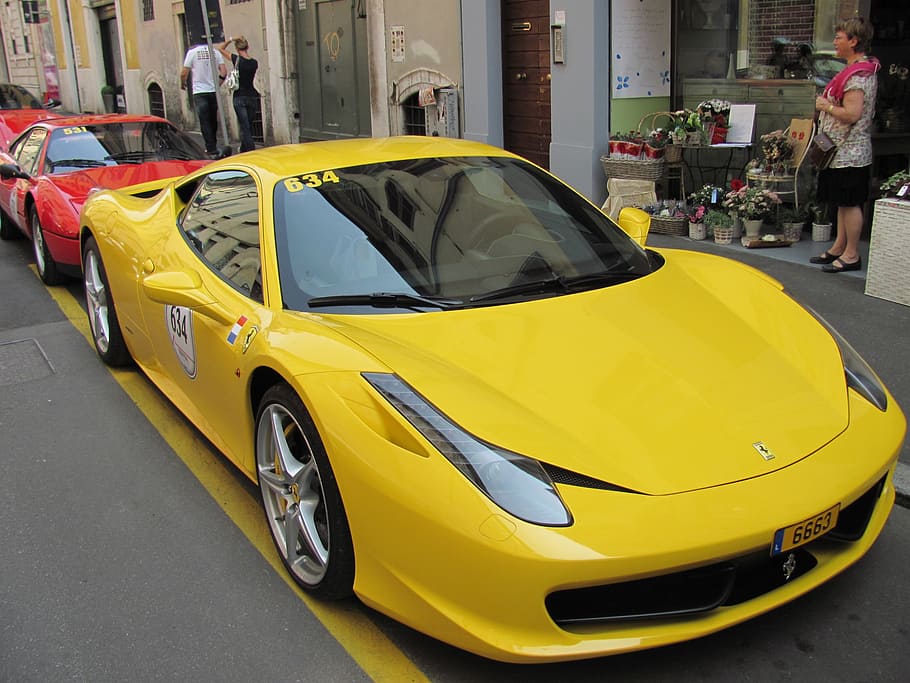 yellow Ferrari 458 Italia coupe parked beside concrete building at daytime, HD wallpaper