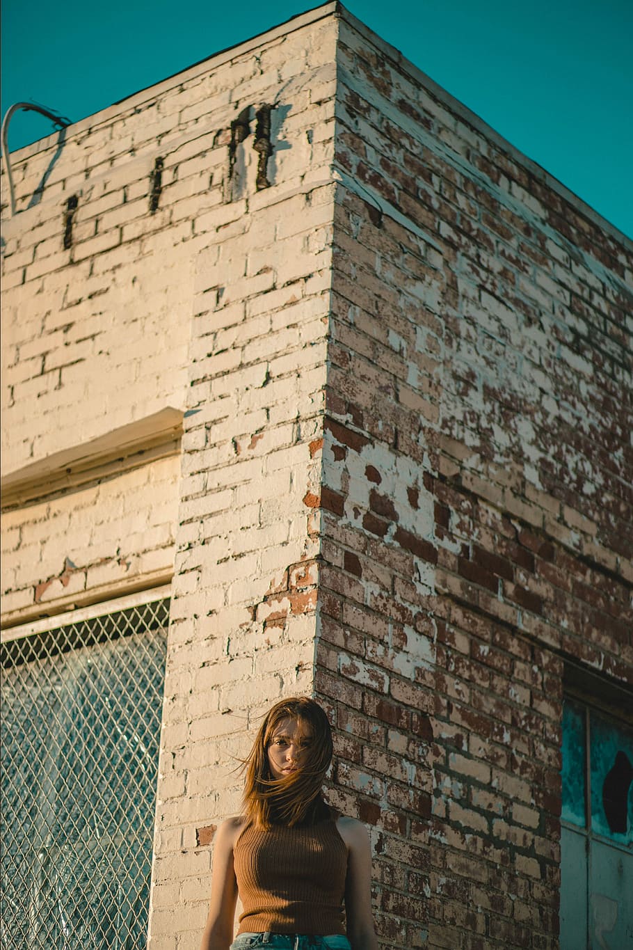 Standing on the corner. Woman standing in the Corner.