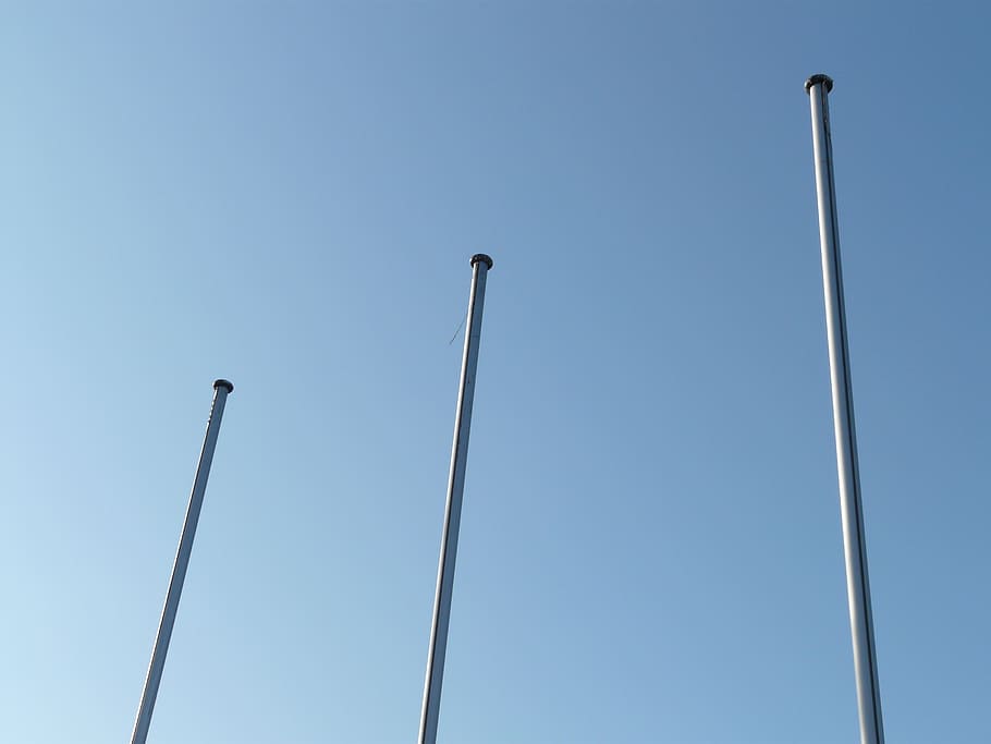 three white metal posts under blue sky, flagpole, masts, empty HD wallpaper