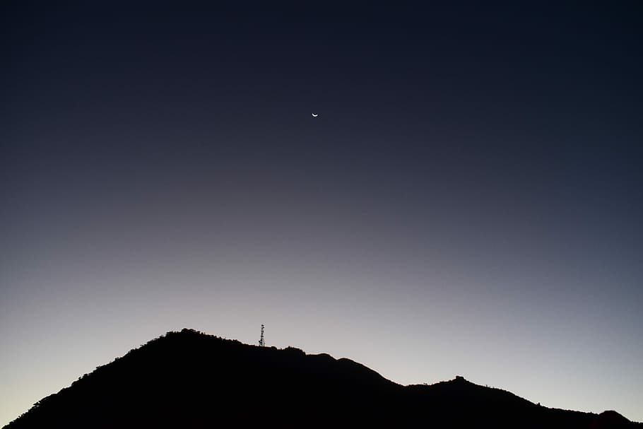 silhouette of mountain, half-moon above silhouette of mountain HD wallpaper