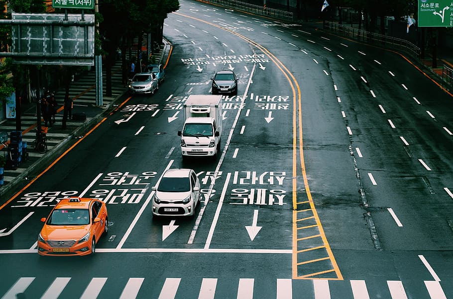 vehicle on gray concrete road taken at daytime, orange and white cars HD wallpaper