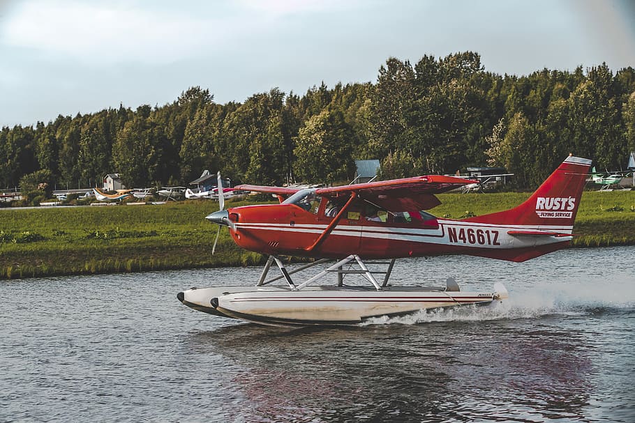 red and white Rusts N46612 biplane on body of water, red and white airplane HD wallpaper