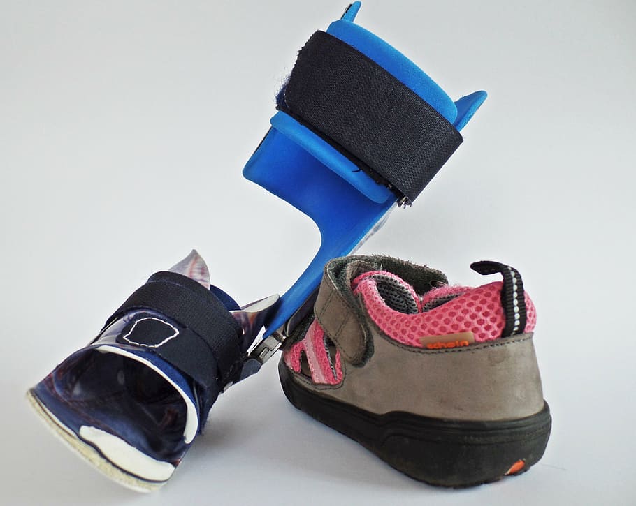 black and blue walking brace and brown and pink leather velcro-strap shoe, HD wallpaper