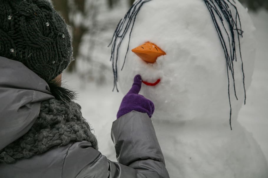 person touching snowman's lip, forest, winter, nature, white HD wallpaper