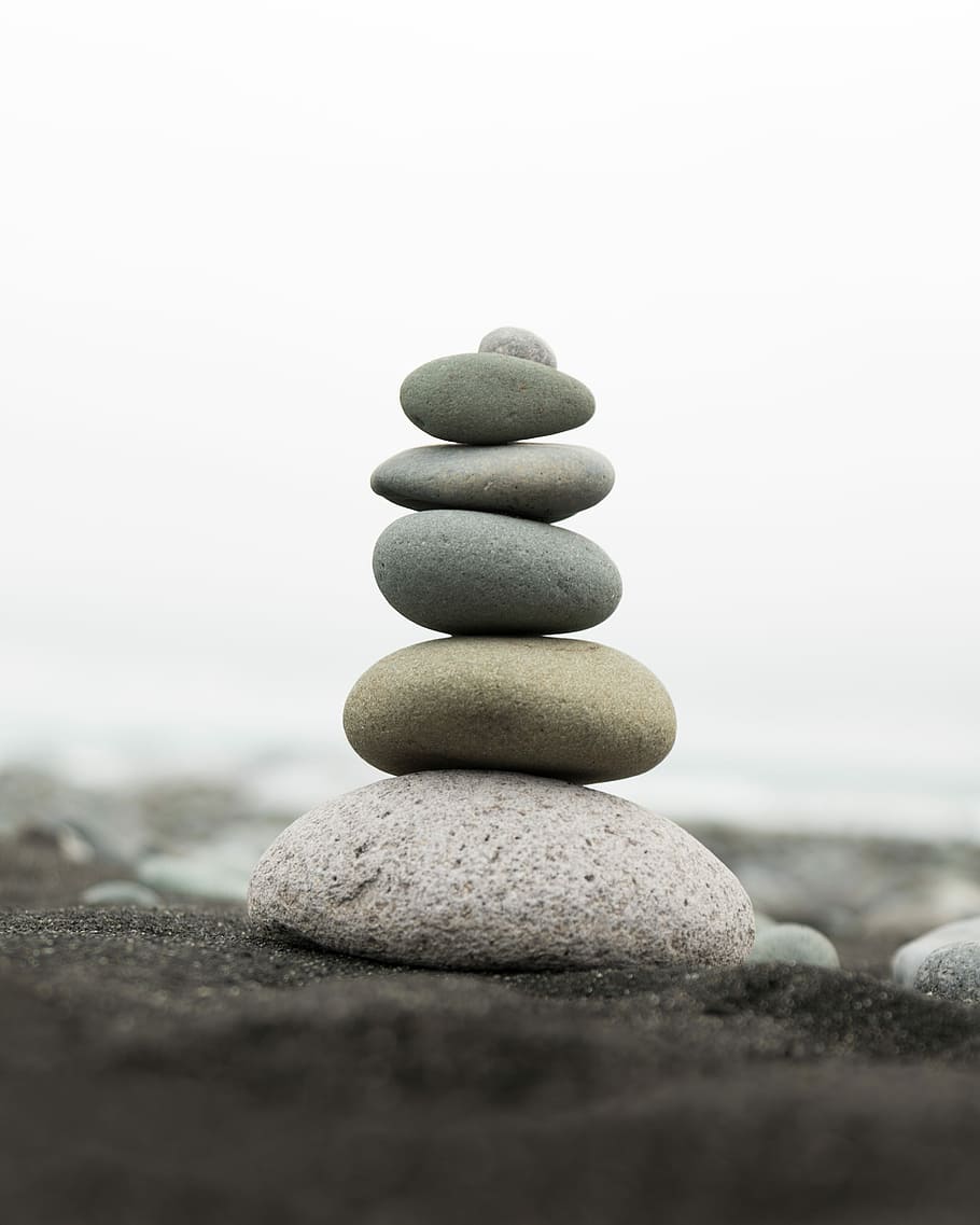 Iceland Rocks, selective focus photography of stacked stones placed on gray sand HD wallpaper