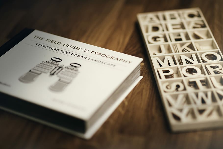 focus photography of The Field Guide To Typography book, The Field Guide to Typography letters with box HD wallpaper