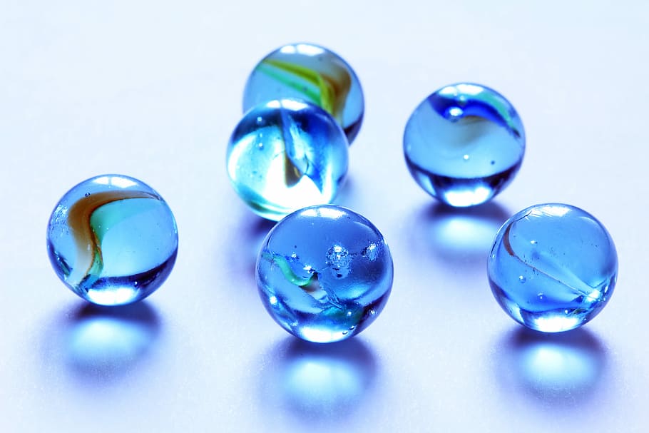 six blue translucent glass marbles, kids, play, round, balls