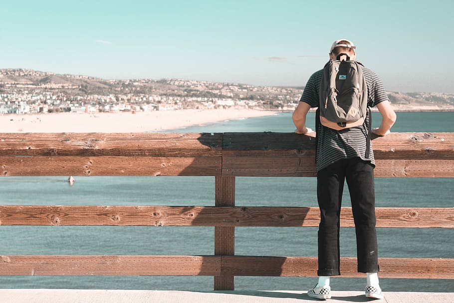 traveling the world, pier by pier, person standing near brown wooden bridge barricade HD wallpaper