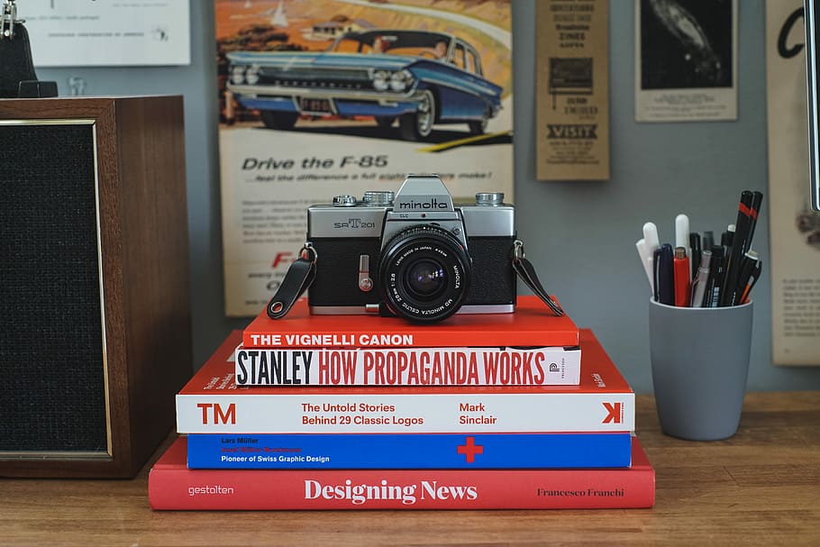 A Clean Workspace, silver Minolta compact camera, book, pen, pot HD wallpaper