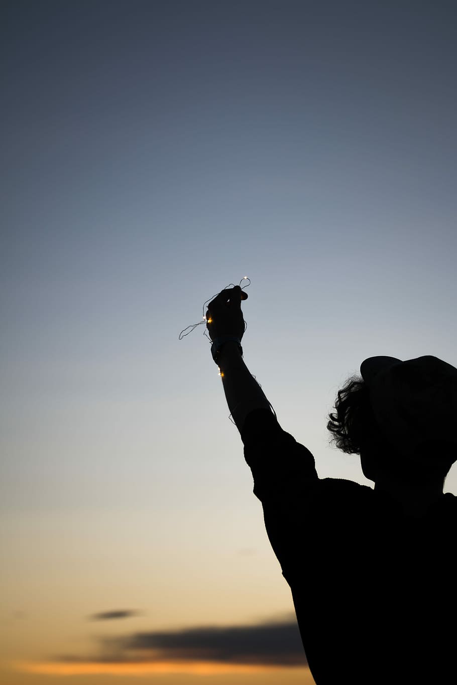silhouette of person holding strings, person raising hand, outside HD wallpaper