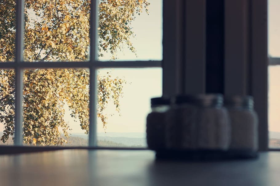 assorted condiment shakers on white wooden table, four condiment shaker on table near the window HD wallpaper