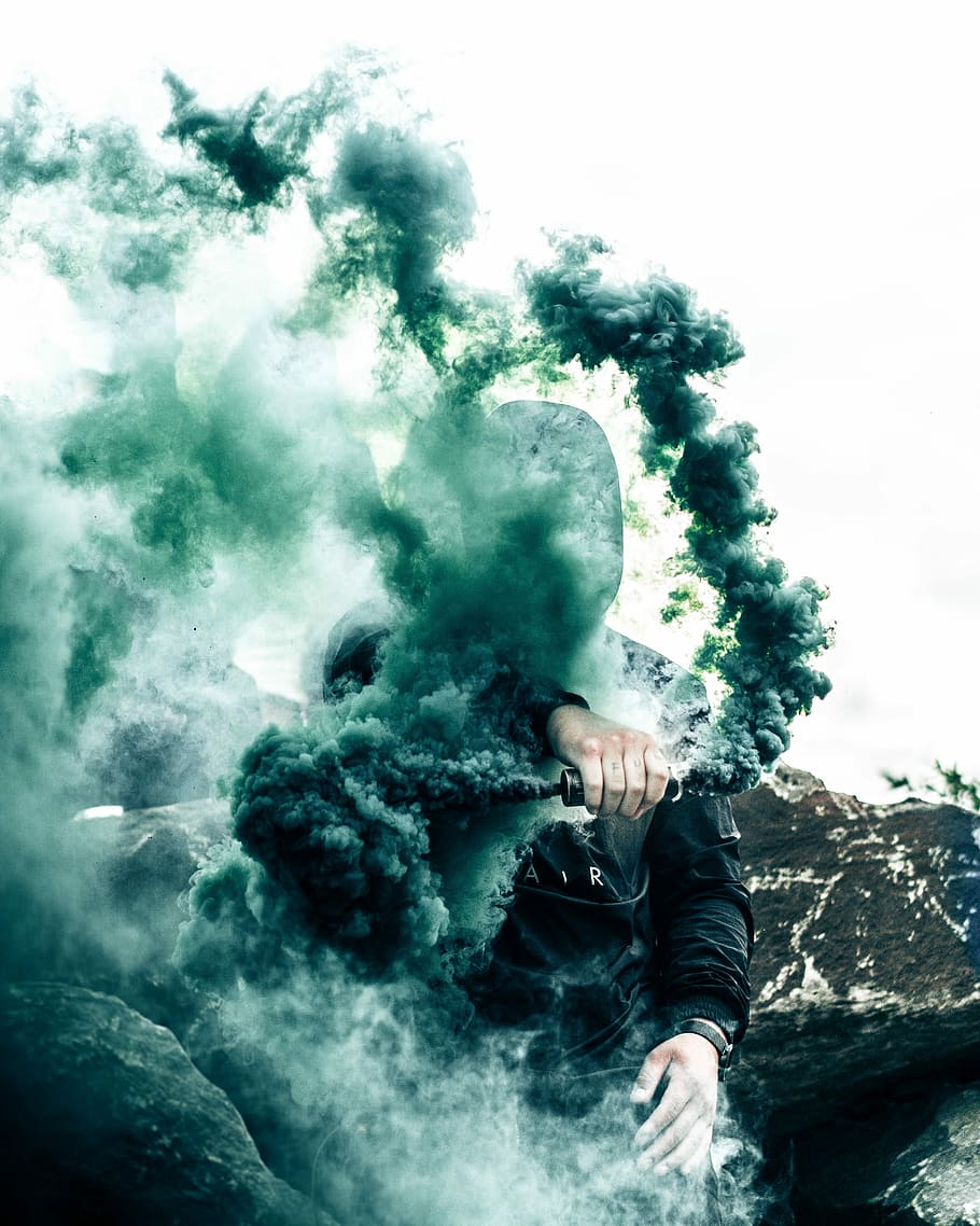 person holding gas grenade, man carrying bottle with green smoke, HD wallpaper